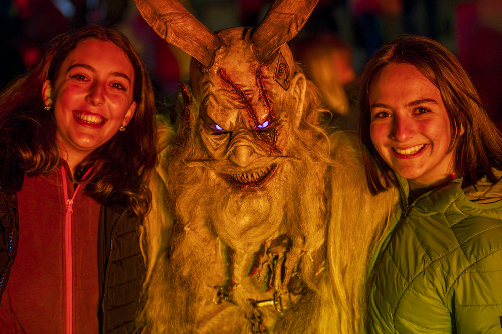 ladies with krampus at a festival